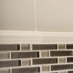 Sphynx Beige 12.125 in. x 10.75 in. Interlocking Glossy Glass Mosaic Tile (9.05 sq. ft./Case) by Jeffrey Court -Ivy Hill Tile Sales beige jeffrey court glass tile 99569 a0 1000